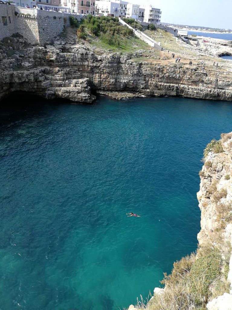 An autumn swim in Polignano a Mare